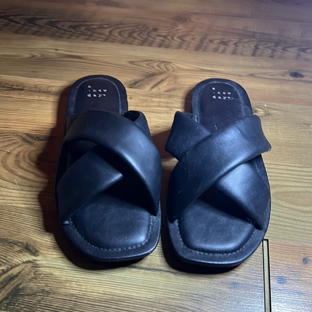 New never worn black a new day target flip flops. Size 7.